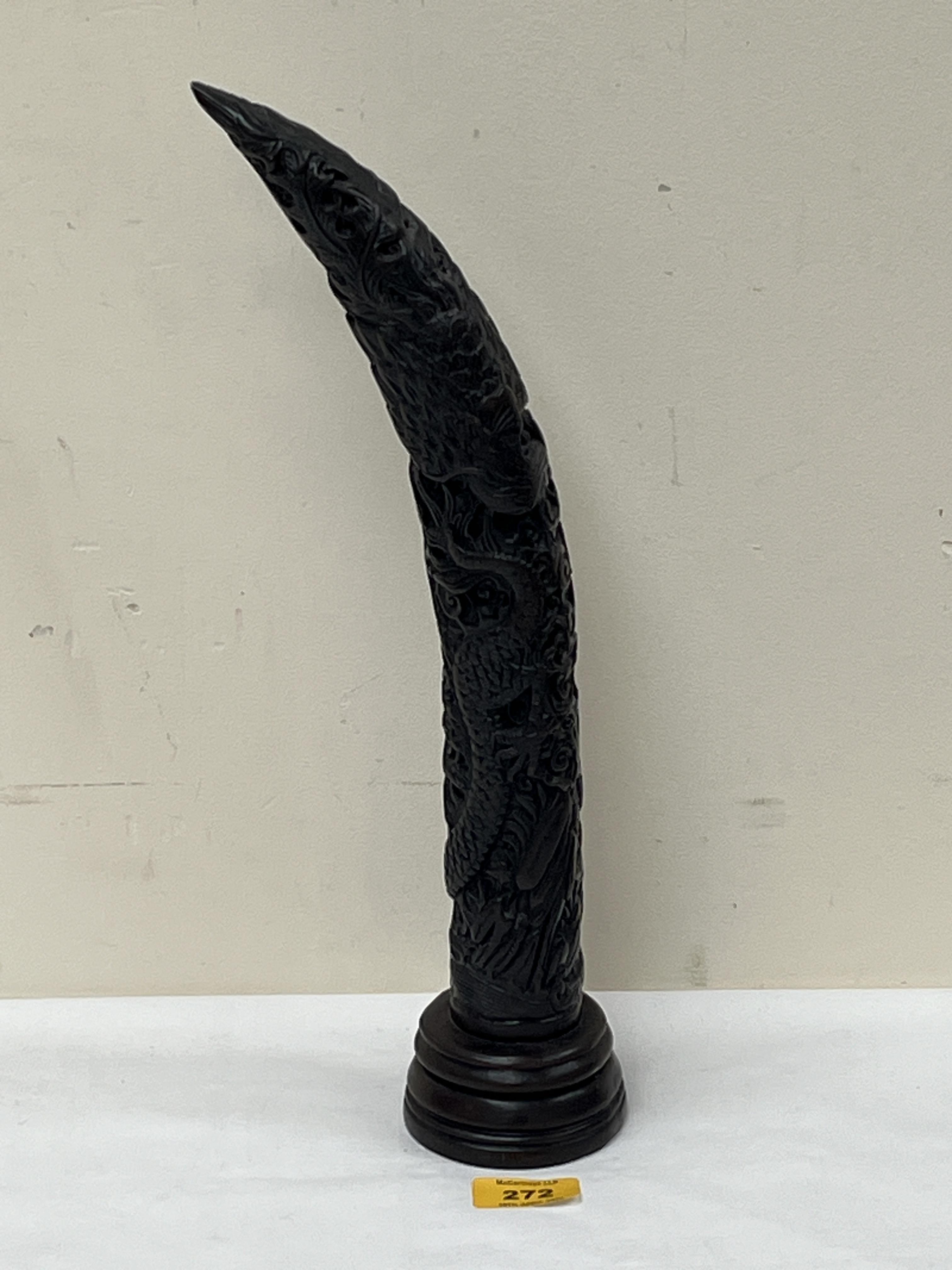 A resinous decorated horn form ornament, 15" high