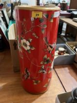 A ceramic stickstand, decorated with birds and prunus. 18½" high.