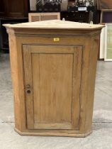 A pine hanging corner cupboard 38" high