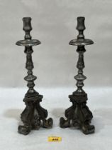 A pair of gothic style pewter candlesticks, 13½" high.