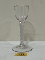 An 18th Century cordial glass with multiple air-twist stem and domed foot. 5½" high.