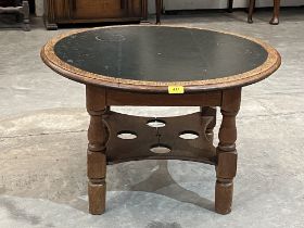 An oak low table with inlet top. 30" diam.