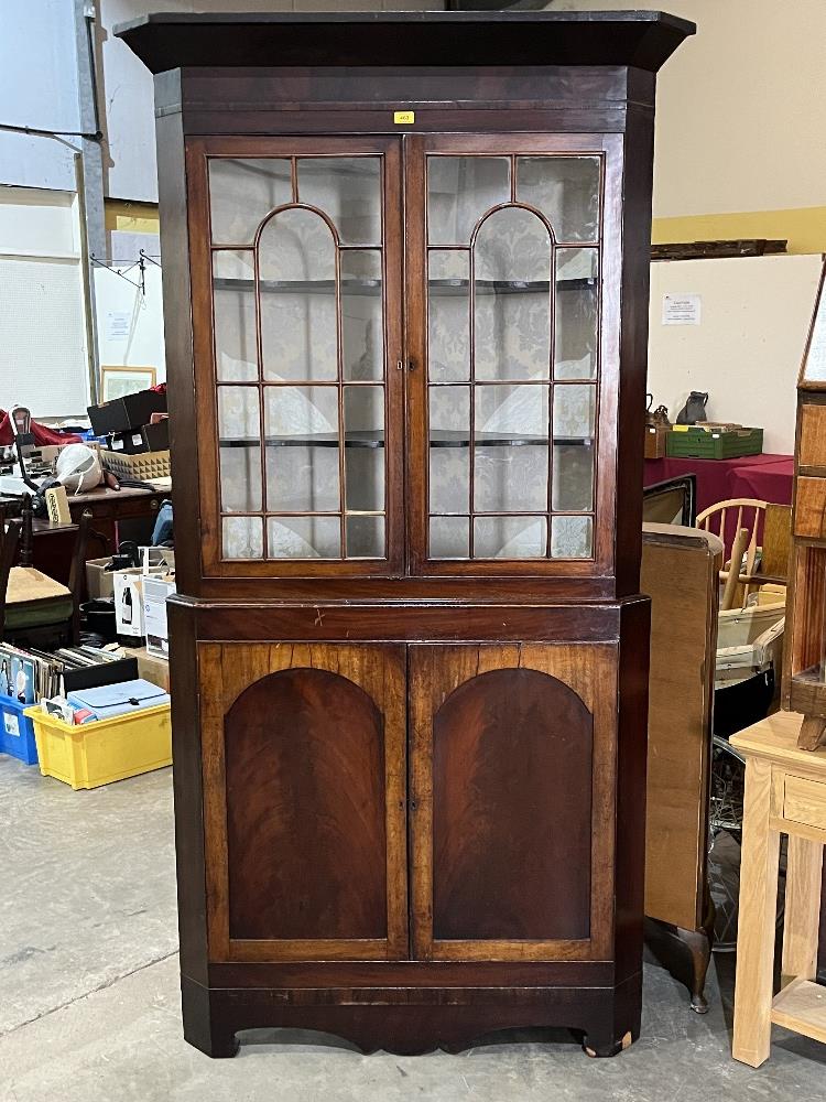 A 19th Century mahogany standing corner cupboard. 87" high.