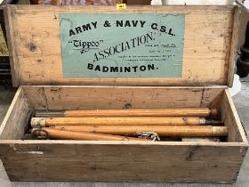 A pine boxed Army and Navy 'Tippoo' set of Badminton poles with trussed net.