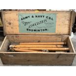 A pine boxed Army and Navy 'Tippoo' set of Badminton poles with trussed net.