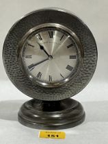 An early 19th Century planished pewter cased mantle timepiece, the silvered dial signed Walker &