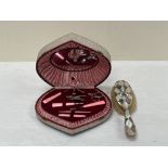 A Lador musical vanity box and an abalone shell parquetry hair brush.