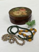 A papier-mache box with cloisonne necklace, jade bangle, Peking glass bison etc.