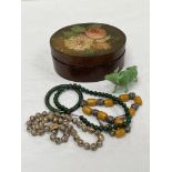 A papier-mache box with cloisonne necklace, jade bangle, Peking glass bison etc.