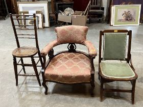 A Victorian tub chair, a Victorian Arts and crafts cane seat chair, and a work chair (3)