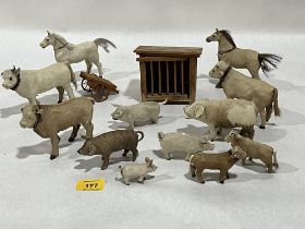 A collection of animal skin toy farm animals with a wooden hutch and cart. The pig 4¼" long.