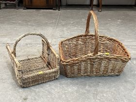 Two wicker baskets, the larger 28" wide.