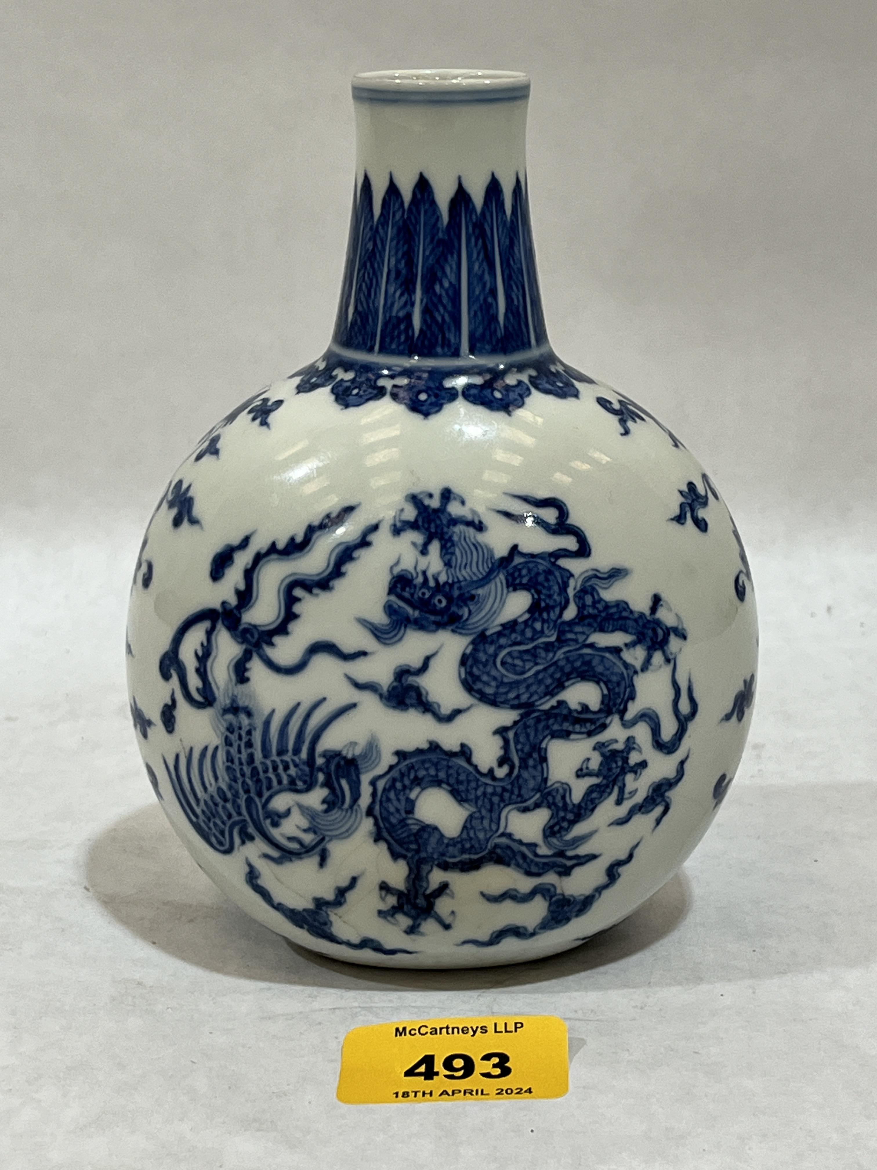 A Chinese globular vase decorated in blue and white with dragons, birds and foliage. 6¼" high. - Image 2 of 3