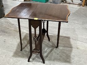 An Edward VII mahogany sutherland table with crossbanded top. 26" wide