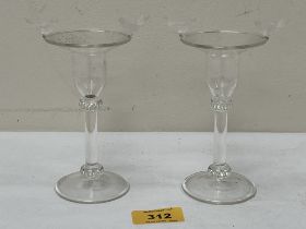 A pair of glass candlesticks, the rims applied with frosted glass birds. 5¼" high.