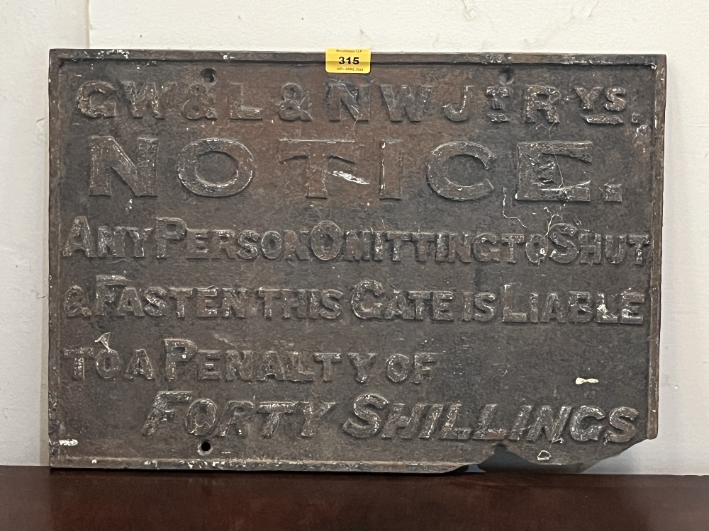 A cast iron railway sign. 14" x 21". Losses.