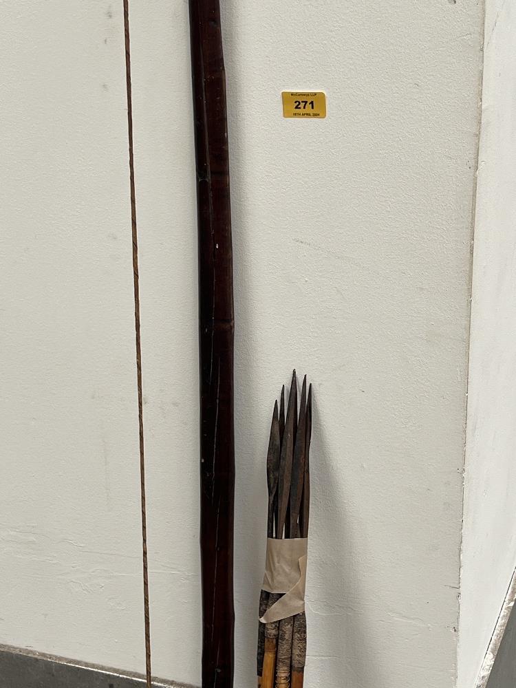 A treen longbow, 63" long, with eight spear tip arrows