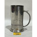 An Art-Nouveau Tudric pewter mug decorated with stylised poppies in low relief. 5¼" high.
