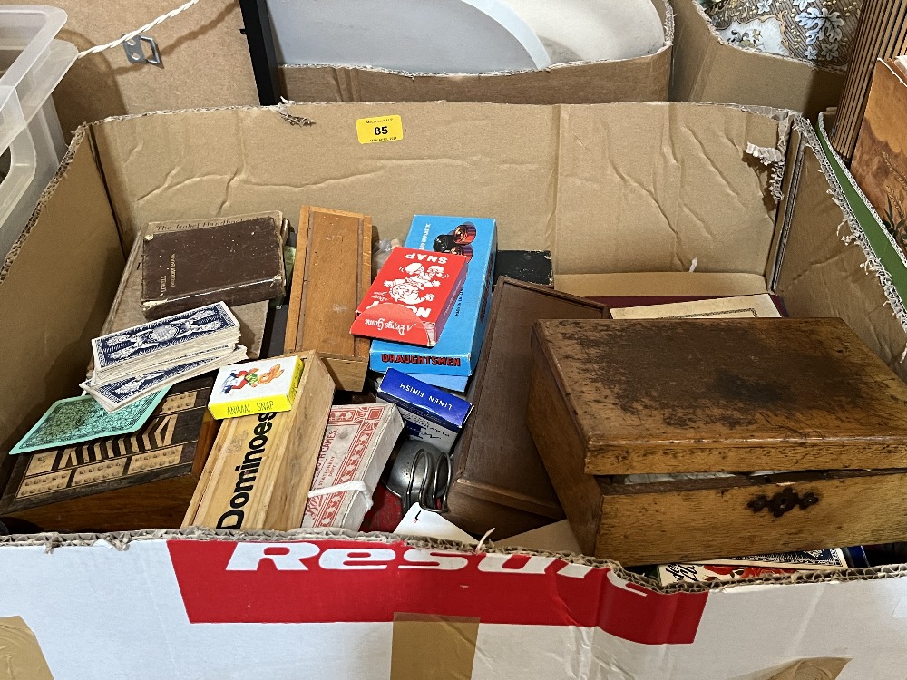 A box of old games and sundries.