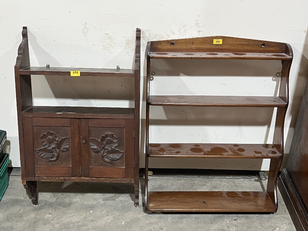 A carved mural cupboard and a set of mahogany wall shelves.