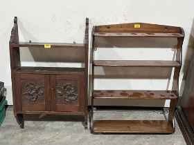 A carved mural cupboard and a set of mahogany wall shelves.