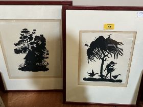 Two framed cut paper silhouettes.