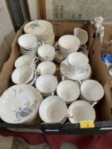 A box of Regency Blue Leaves pattern teaware.