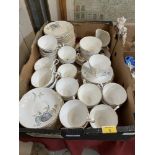 A box of Regency Blue Leaves pattern teaware.