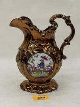 A 19th Century copper lustre jug decorated with chinoiserie panels. 8" high.