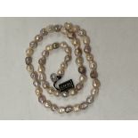 A Honora ming pearl necklace with silver clasp. 30" long.