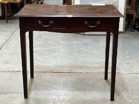 A 19th Century mahogany side table with a pair of frieze drawers, on square tapered legs. 34" wide.