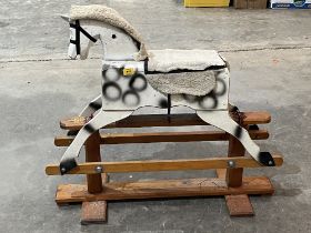 A 3' rocking horse on trestle base.