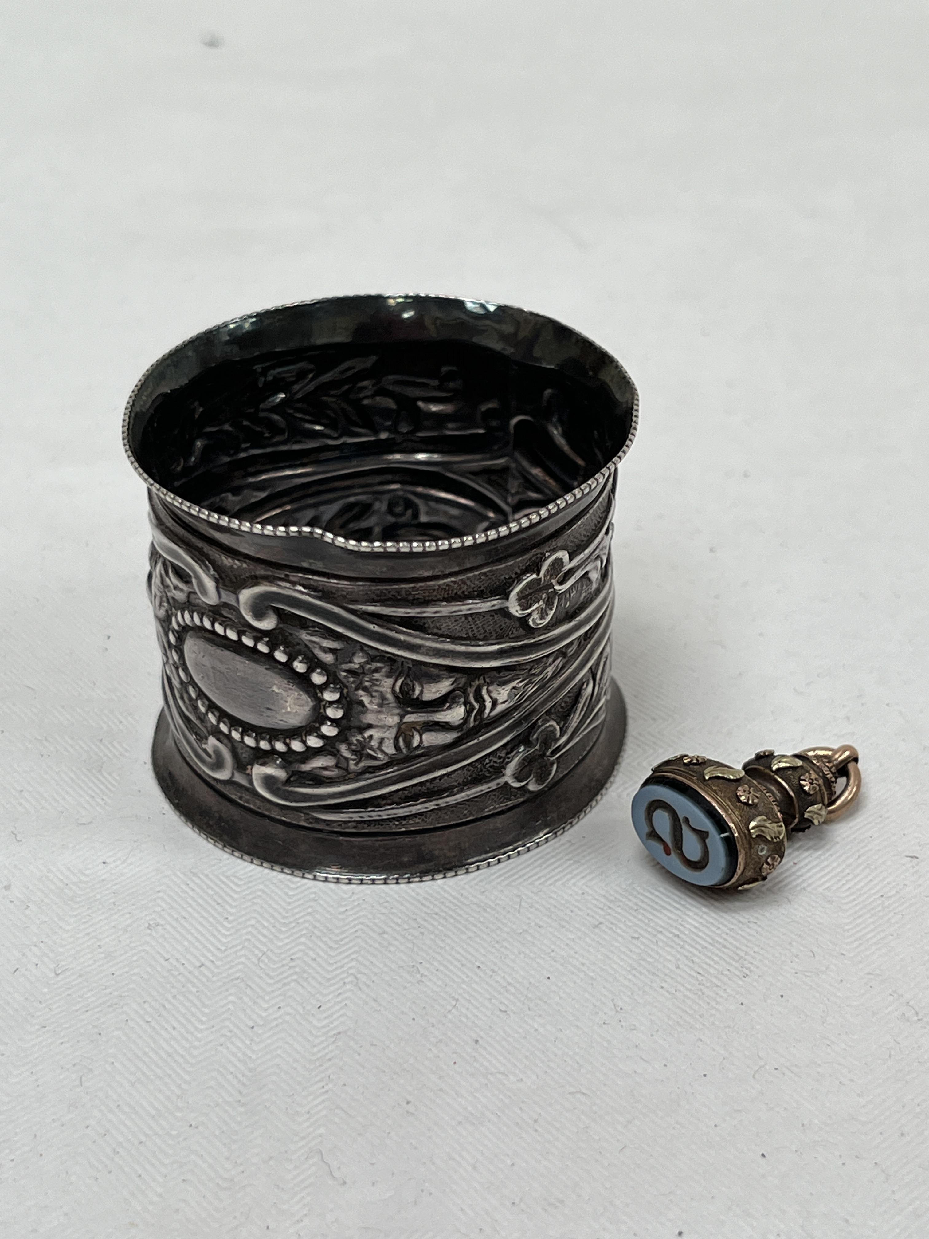 A 19th Century seal with hardstone matrix and a Victorian silver napkin ring, London 1896.