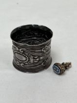 A 19th Century seal with hardstone matrix and a Victorian silver napkin ring, London 1896.