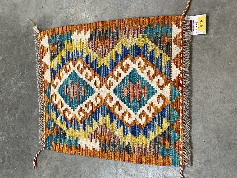 A Chobi Kilim small rug. 0.57m x 0.45m.