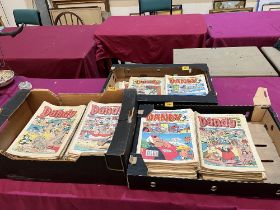 Three boxes of Dandy comics.