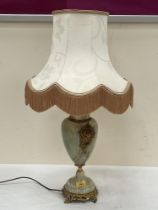 An onyx and gilt metal mounted table lamp. 16" high excluding fitting.