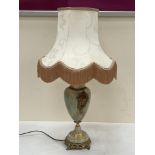 An onyx and gilt metal mounted table lamp. 16" high excluding fitting.