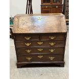 A George III mahogany bureau with fitted interior, on later bracket feet. 36" wide.