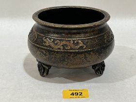 A Chinese bronze censer. Four figure character mark to base. 5½" diam.