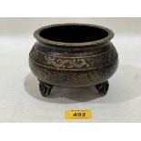 A Chinese bronze censer. Four figure character mark to base. 5½" diam.