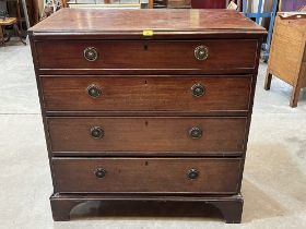 A George III mahogany chest of four long drawers, on bracket feet. 39" wide