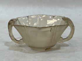 A Chinese hardstone lobed cup with leaf carved handles.