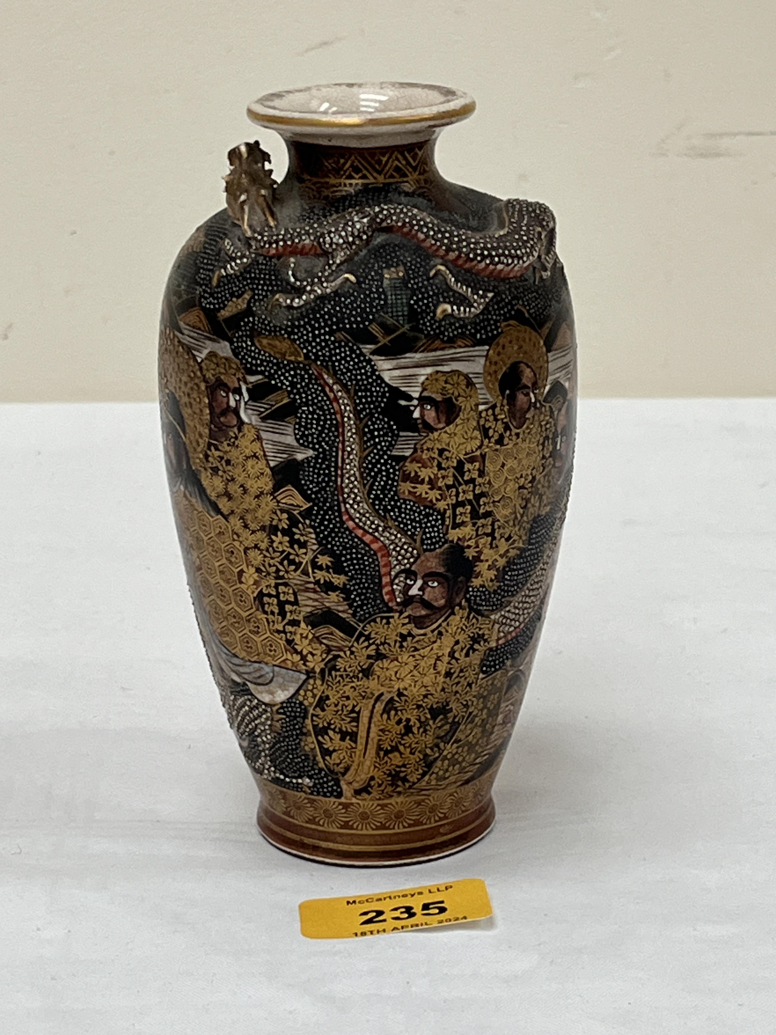 A Japanese satsuma vase gilded and painted with figures and dragons. Signed to base. Meiji. 6¼"