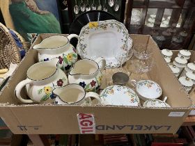 A box of ceramics and glassware.