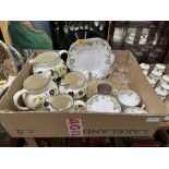 A box of ceramics and glassware.