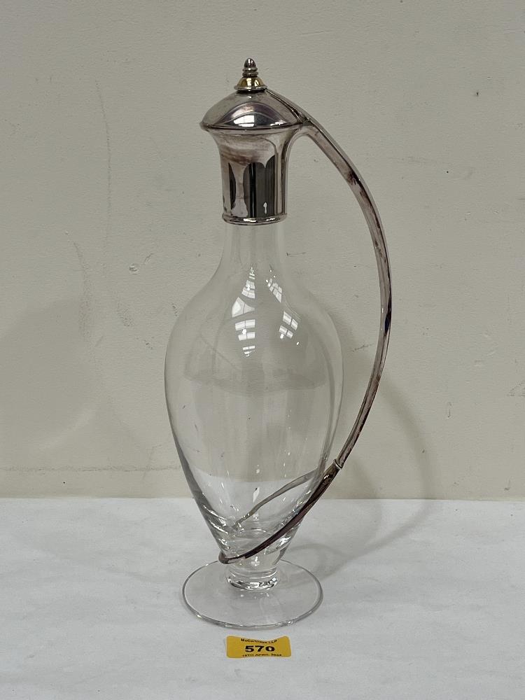 A claret jug with silver mount, lid and handle. Marked 925 and dated 2000. 13" high. Maker: Robert J