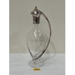 A claret jug with silver mount, lid and handle. Marked 925 and dated 2000. 13" high. Maker: Robert J