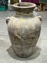 A terracotta urn. 35" high. Repaired.