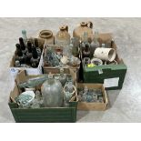 A collection of old bottles and jars.